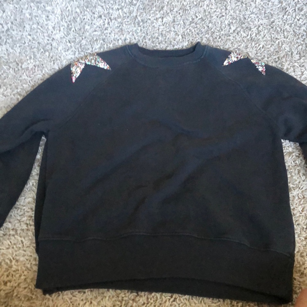 dark grey crewneck with jewel stars on the shoulders